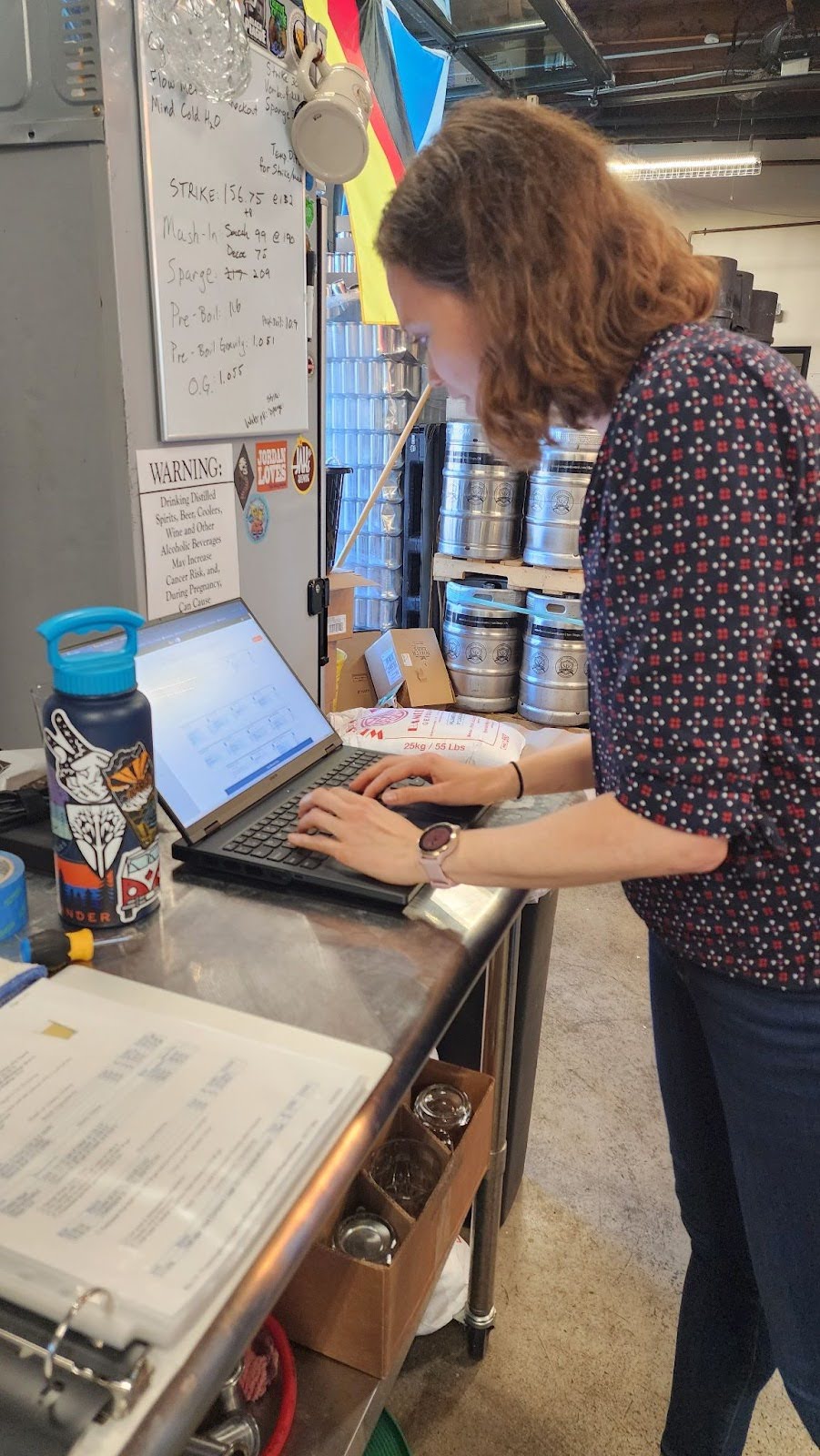 Scientist notekeeping on a laptop