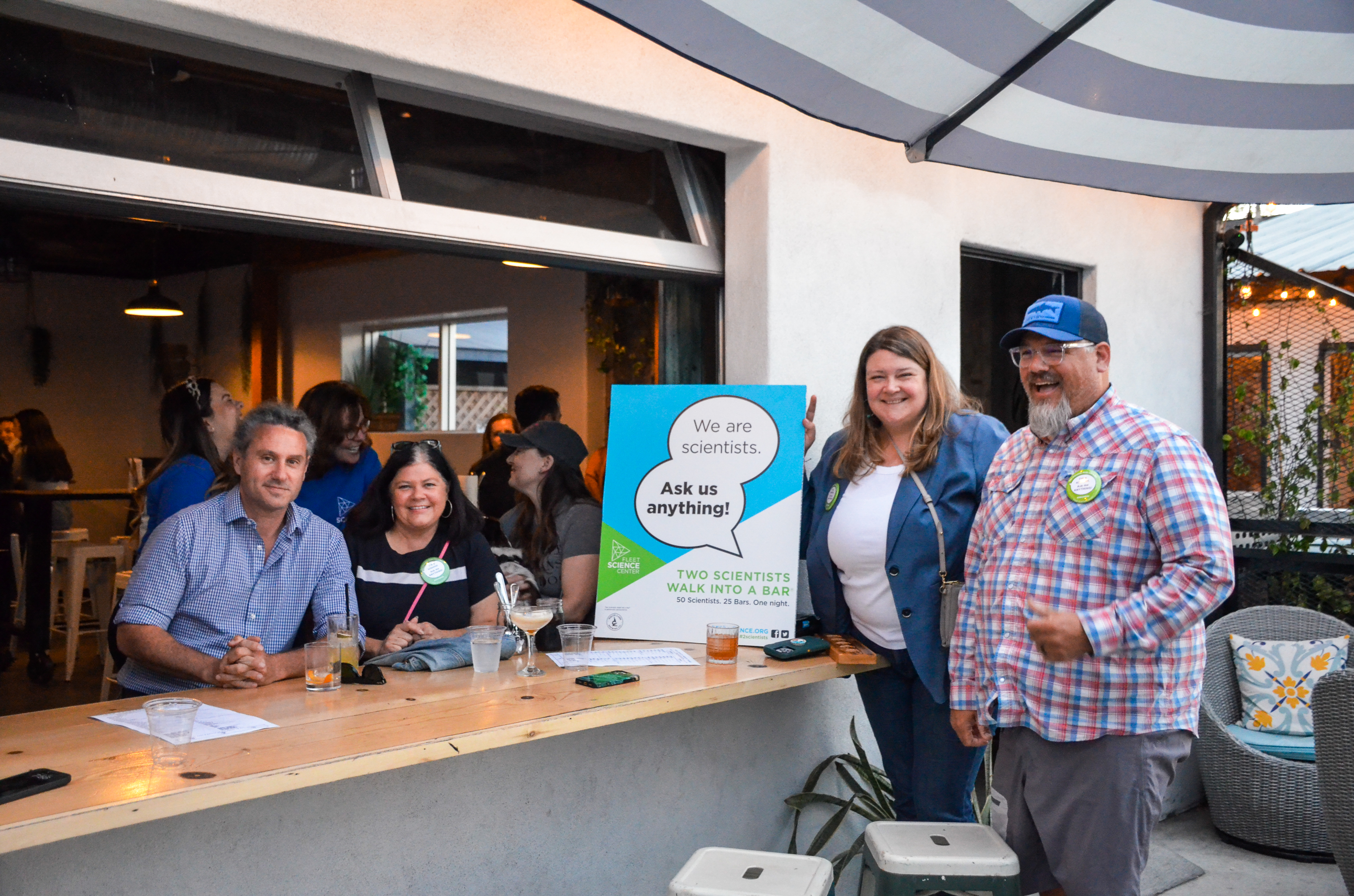 Science professionals gathered for Two Scientists Walk Into a Bar outdoors