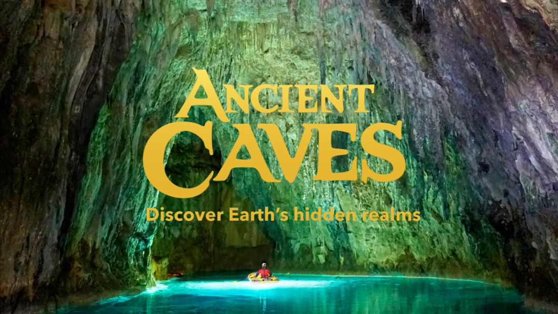 Image of a large cave with a person on a skiff in the center of the water. Image has text that reads "Ancient Caves. Discover Earth's Hidden Realms"