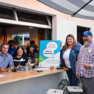 Science professionals gathered for Two Scientists Walk Into a Bar outdoors